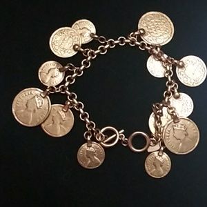 Goldtone bracelet with dangling coins.